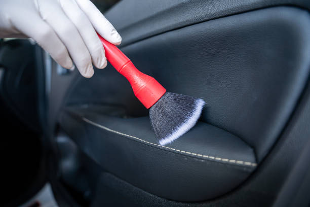 istock Man's hand is cleaning car at garage 1449393034