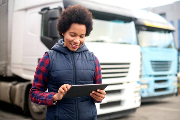Female truck driver using a tablet stock photo