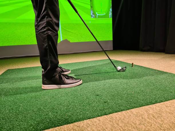 istock Male golfer plays golf indoors on golf simulator closeup 1449393591