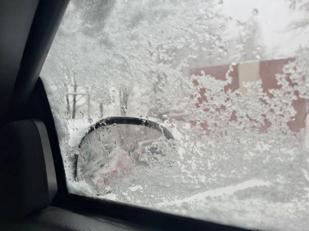 istock Snow on side glass and view from inside car 1449395097
