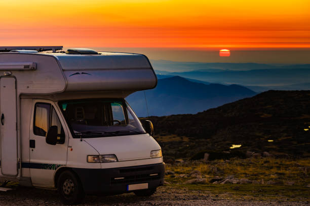 istock Rv camper camping in mountain at sunset. 1449401051