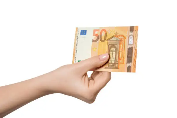 50 euro banknote in a female hand, isolate