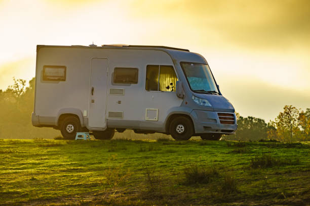 istock Camper rv camping on nature. 1449401690