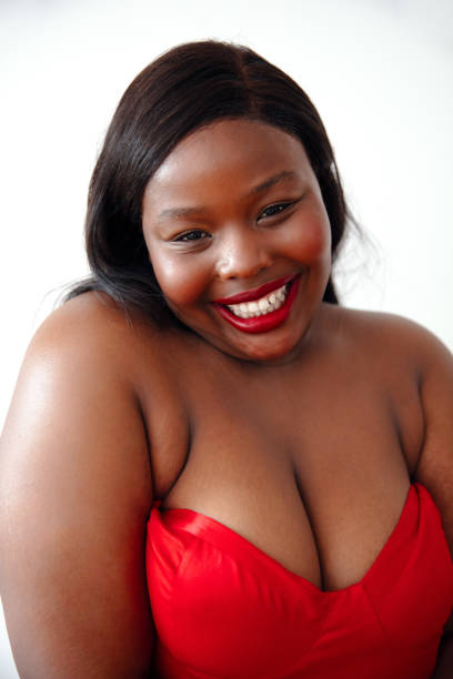Beautiful Happy Woman Posing In Studio. Beautiful Happy Woman In Colorful Makeup Posing In Studio. Beauty. plus size woman fashion laughing stock pictures, royalty-free photos & images