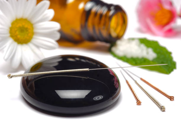 istock alternative medicine with herbal pills and acupuncture 1449403464