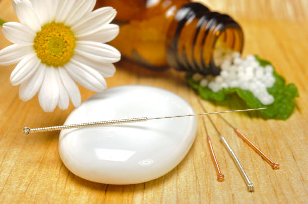 istock alternative medicine with herbal pills and acupuncture 1449403534