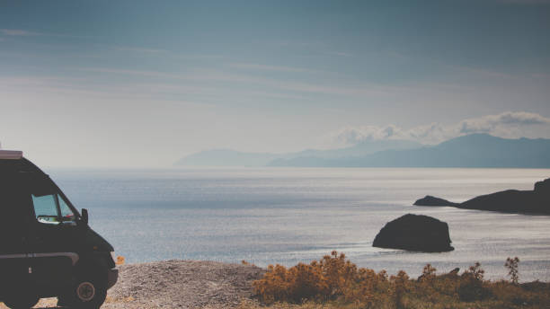 istock Camper car on beach sea shore. Travel 1449403693