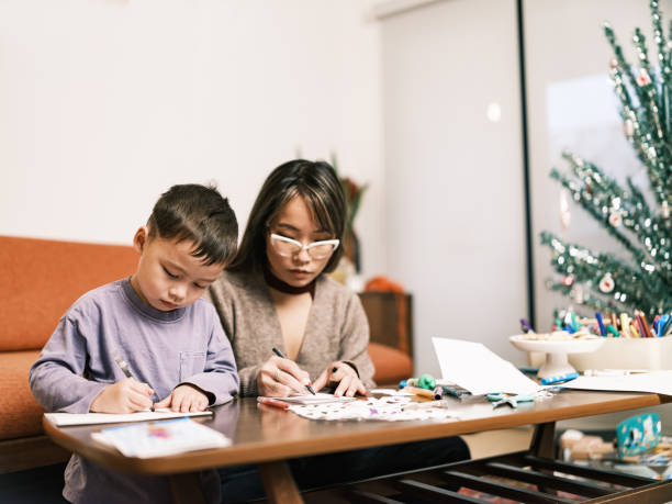 istock Mother and son doing Christmas arts and crafts 1449403782