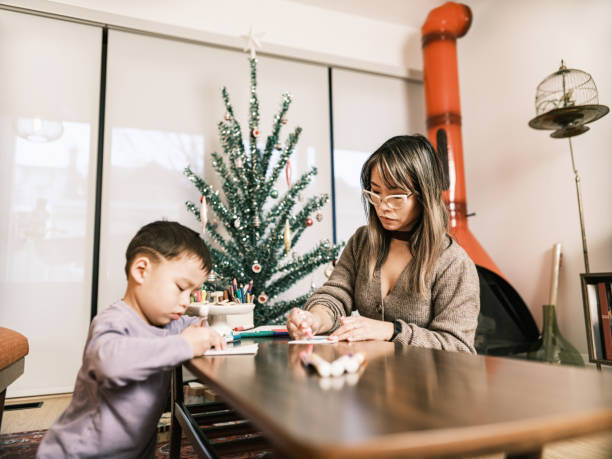 istock Mother and son doing Christmas arts and crafts 1449404102