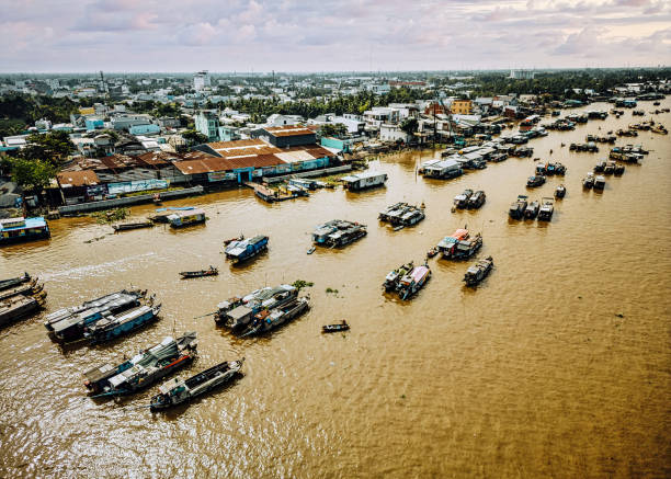 busy floating market in Mekong Delta region of Vietnam stock photo