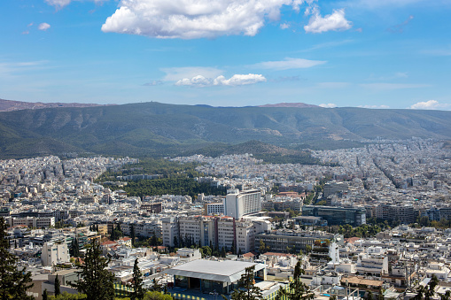 Greece. Panoramic view of Athens city, building, skyscraper, nature Attica capital blue cloudy sky background. Above view from Lycabettus hill.
