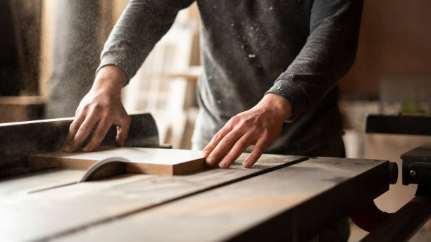istock close-up carpenter cutting wood 1449407283