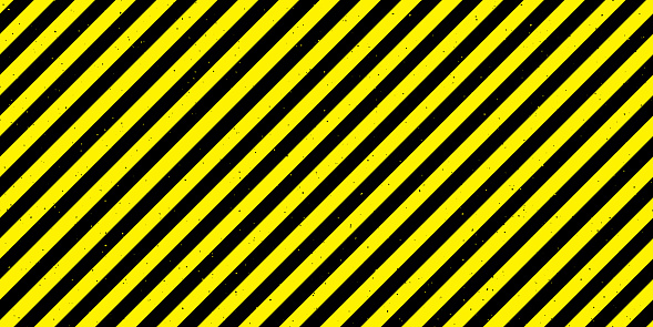 Textured caution tape seamless pattern. Yellow and black diagonal stripes repeated background. Danger warning wallpaper. Vector backdrop