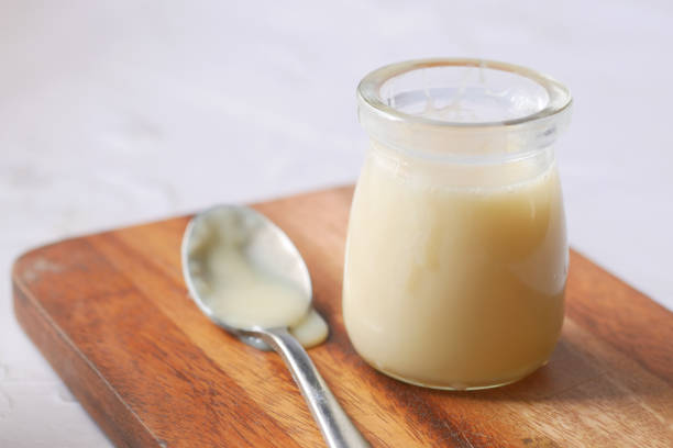 istock condensed milk in a bowl close up, 1449410785