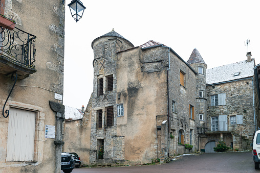 Street in the beautiful village of Montresor, Loire, France, with St John the Baptist Collegiate Church
