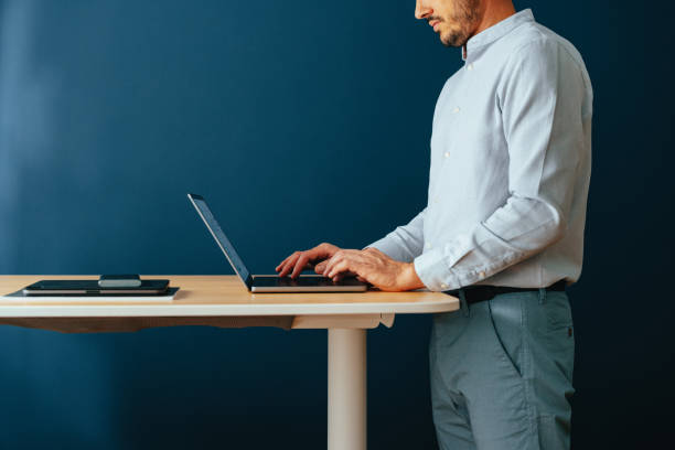 An Anonymous Businessman Using Laptop Computer At Home