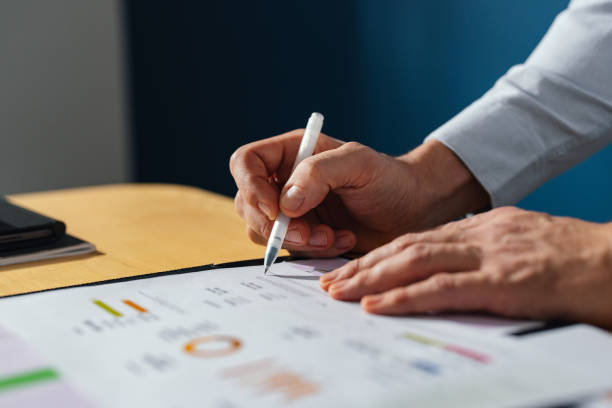 istock An Anonymous Businessman Working With Documents At Home 1449412423
