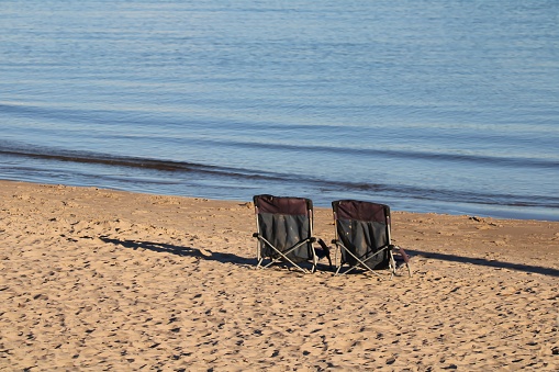Two Lone Chairs on Lake Michigan Beach