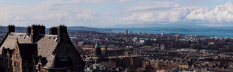 A panoramic cityscape of Edinburgh on a sunny day