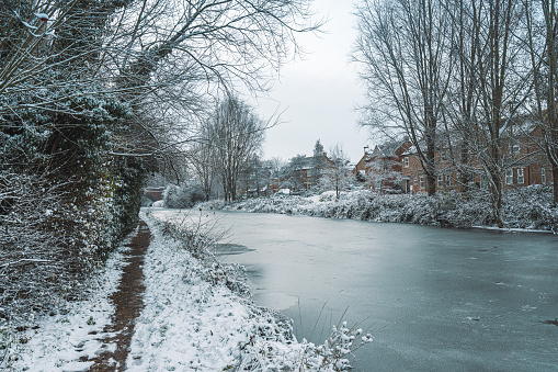Canal captured during snowfall in winter