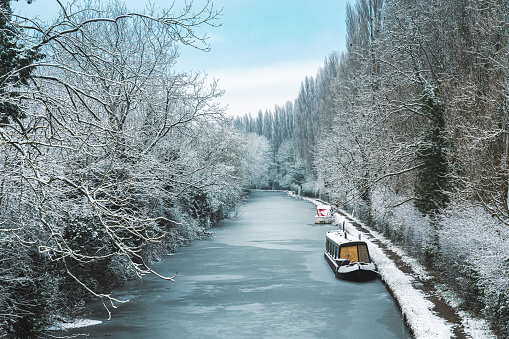 Narrow boat on the Bridgewater canal during cold weather in England