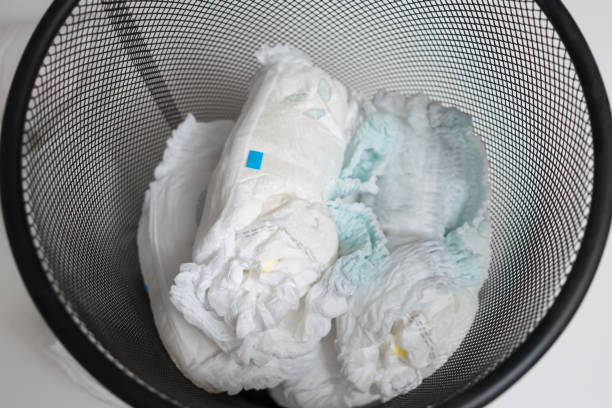 istock Used diapers in bin, top view. 1449419686