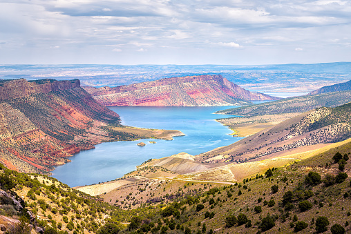 Panoramic view of Sheep Creek Overlook in Manila, Utah near Flaming Gorge National Park with clouds valley and river