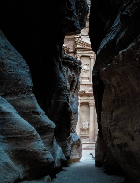 istock Vertical shot of a monastery in Petra, Jordan seen through cliffs 1449419851