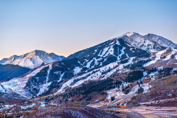 Aerial high angle view of ski resort town city of Aspen, Colorado after early winter snow on Buttermilk mountain with valley in autumn fall Aerial high angle view of ski resort town city of Aspen, Colorado after early winter snow on Buttermilk mountain with valley in autumn fall buttermilk mountain stock pictures, royalty-free photos & images