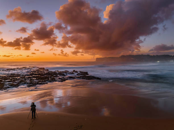 istock Surfs up sunrise at the seaside with scattered clouds 1449424576