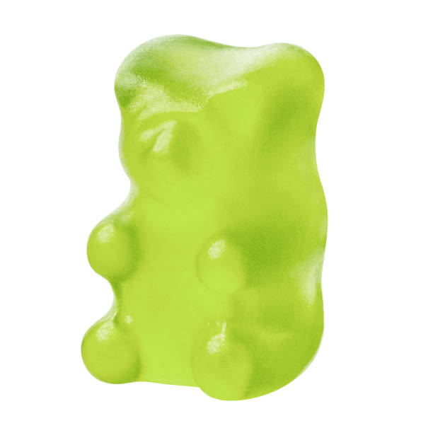 istock Single green jelly gummy bear on white 1449424622
