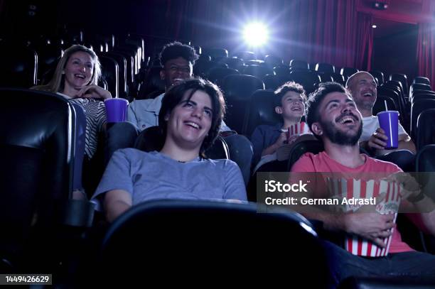 Friends Watching A Movie At The Cinema Stock Photo - Download Image Now - Movie Theater, Film Industry, Movie