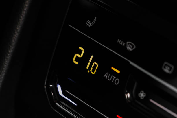 istock Digital control panel car air conditioner dashboard. Modern car interior conditioning buttons inside a car close up view. 1449429931