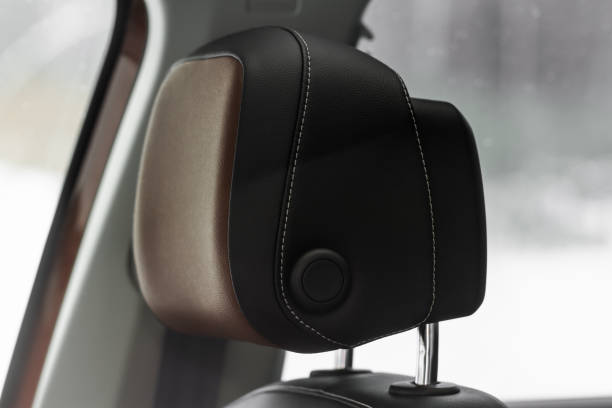 istock Leather car seats close up view. Modern Car Interior details. Leather headrest. 1449429938