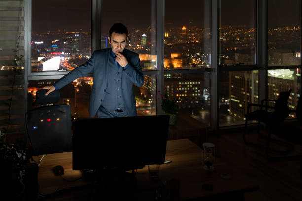 istock image of clerk in the office who is on the evening shift 1449430933