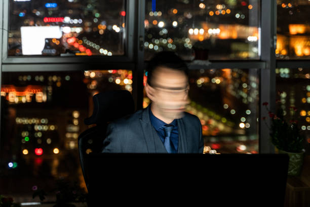 istock image of clerk in the office who is on the evening shift 1449431029