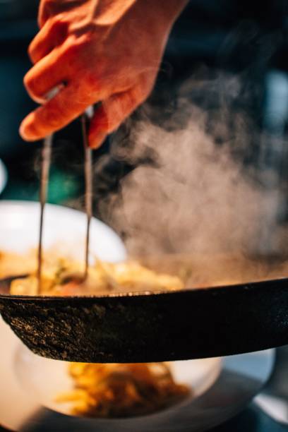 istock Closeup of a cooking process in a pan 1449431104