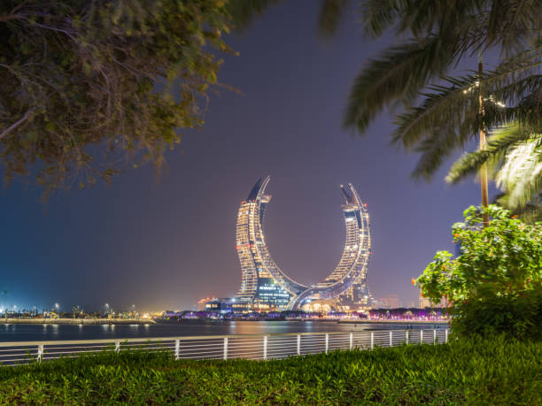 Lusail beachfront park modern buildings at night in Doha, Qatar