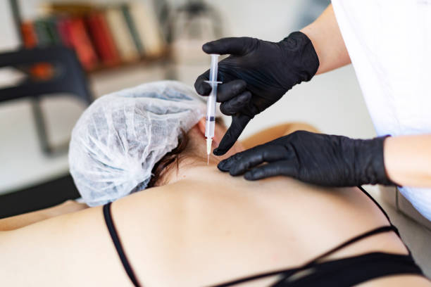 istock Cosmetologist making injections for body correction 1449432067
