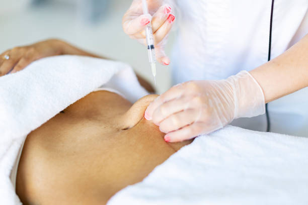 istock Cosmetologist making injections for body correction 1449432102