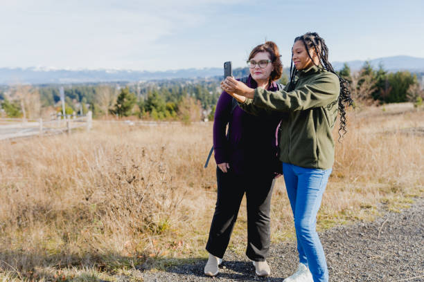 istock Multi Racial Mom and Daughter Winter Hike Together 1449432981