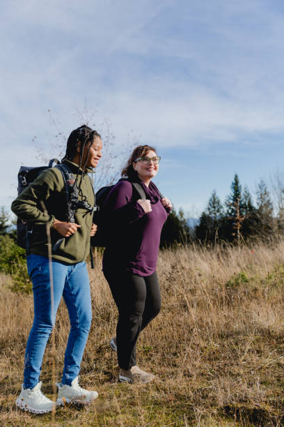 istock Multi Racial Mom and Daughter Winter Hike Together 1449432999