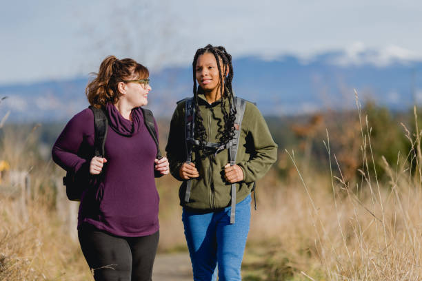 istock Multi Racial Mom and Daughter Winter Hike Together 1449433027