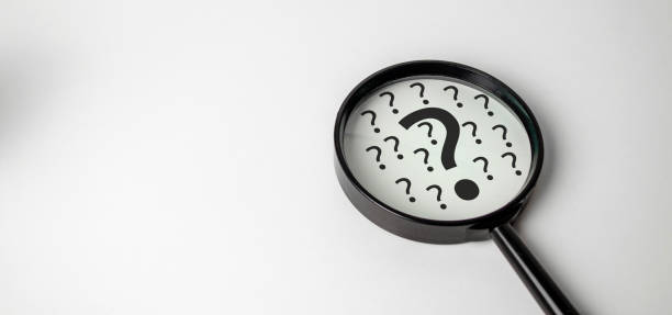 istock Magnifying glass and question mark sign icon. Problems and root cause analysis concept. 1449434284