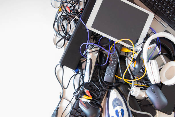 istock Old computers, digital tablets, mobile phones, many used electronic gadgets devices, broken household and appliances on white background. Planned obsolescence, electronic waste for recycling concept 1449436660