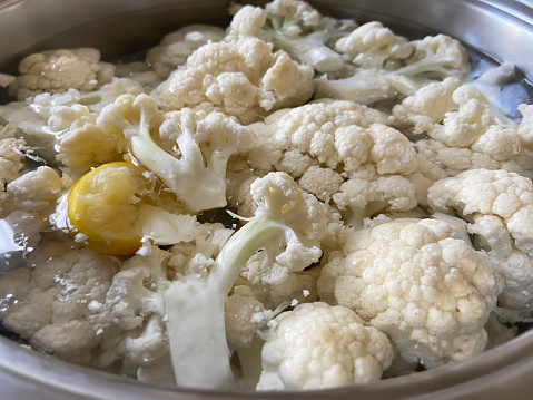 Cauliflowers in the pot of water, preparing cauliflowers vegetable food