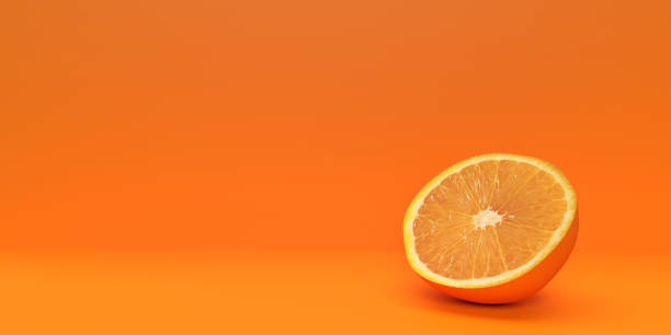 Half cut orange fruit on blank background stock photo