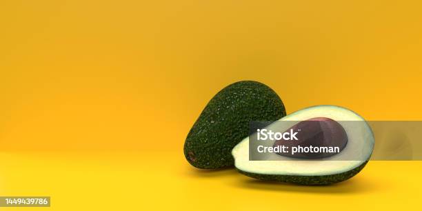 Half Cut Avocado Fruit On Yellow Background Stock Photo - Download Image Now - Ketogenic Diet, Advertisement, Healthy Eating
