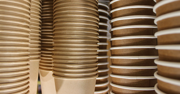 Pattern of stacks of stacked clean craft cups for hot drinks stock photo