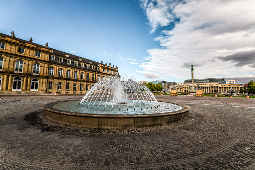 Picture of the fountain of Place des Jacobins square, one of the main landmarks of the city center of Lyon, France, on the Presqu'Ile Peninsula, with pedestrians passing by.